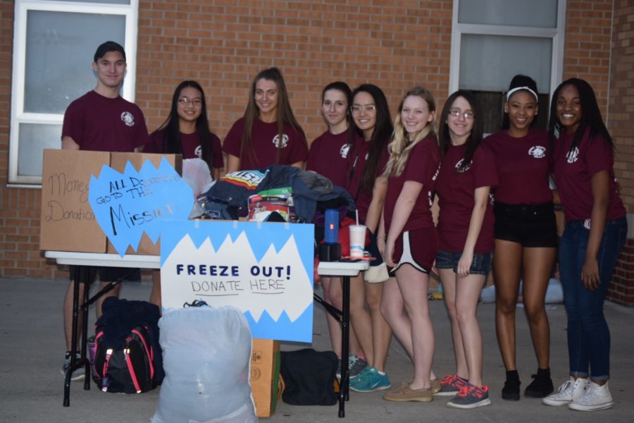 Student Council greeting everyone entering the game.